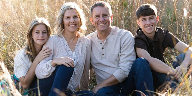 Smith family professional photo: when refinancing to afford life catches up.